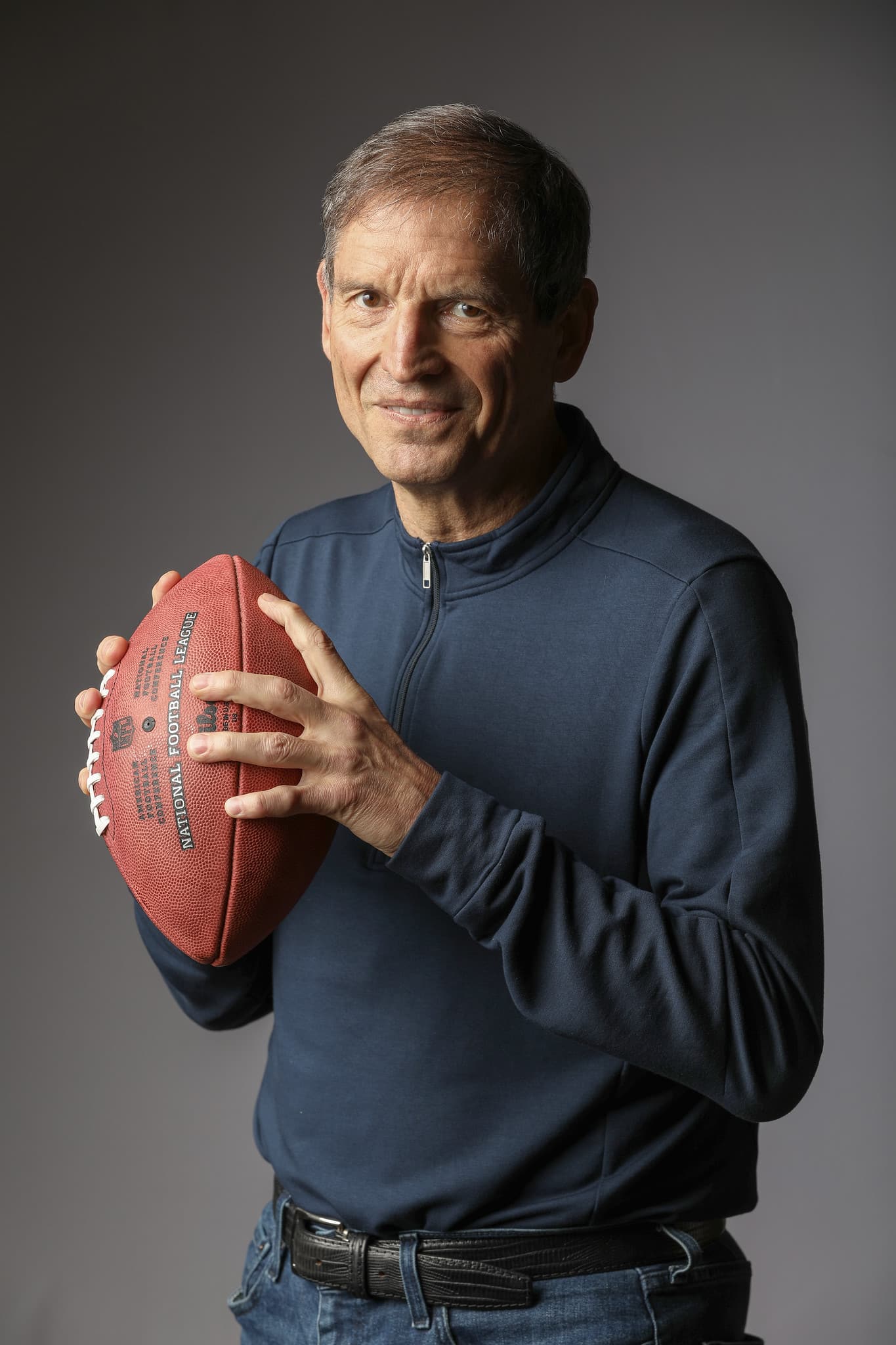 Bernie Kosar holding football